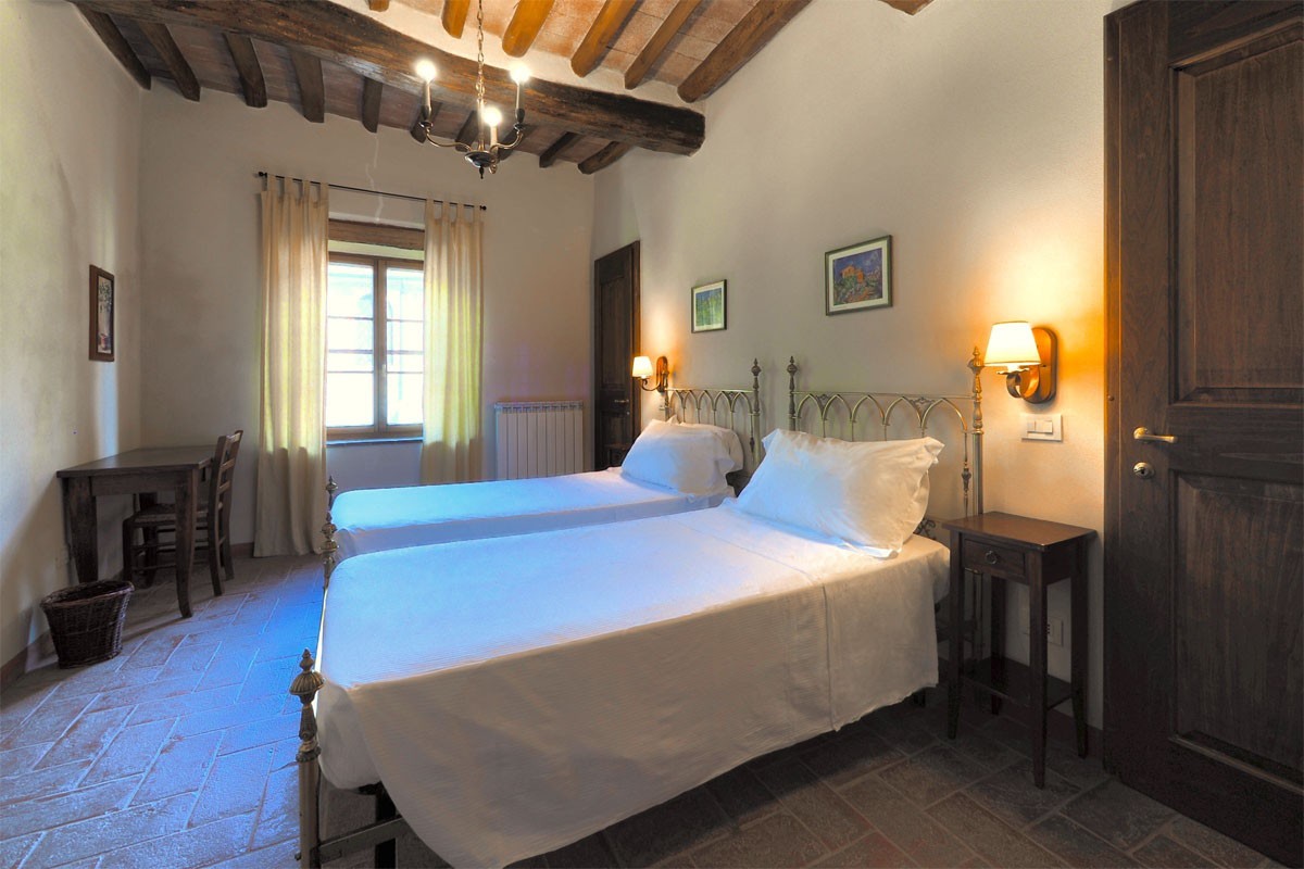 Bedroom two San Giovanni East: historic room in the Castle - Chianti villa rentals